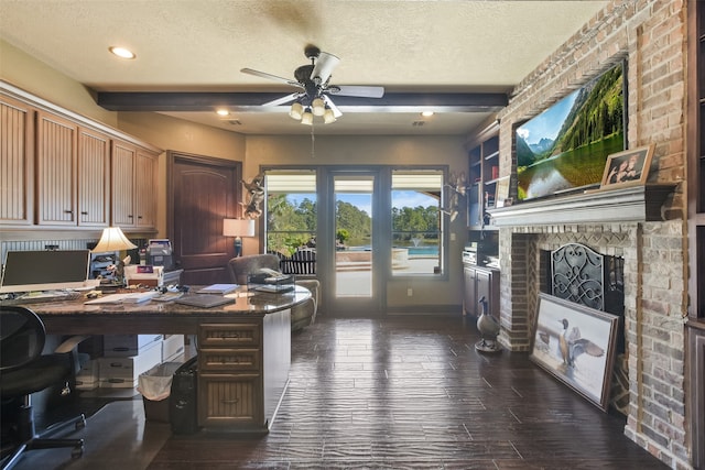 home office featuring beamed ceiling, a textured ceiling, and ceiling fan