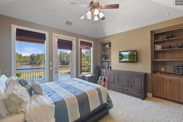 27918 Hansons Ct, Spring, TX 77386 - bedroom featuring access to exterior, multiple windows, light colored carpet, and a water view