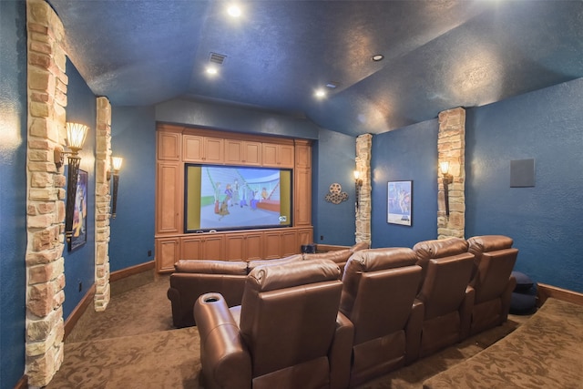 cinema room featuring vaulted ceiling