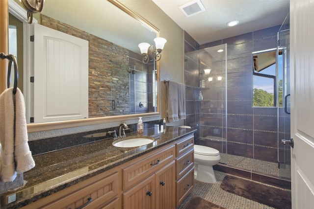 27918 Hansons Ct, Spring, TX 77386 - bathroom featuring toilet, a stall shower, tile patterned floors, and vanity