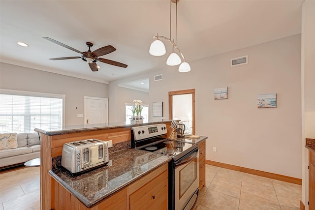 kitchen featuring light tile patterned floors, ceiling fan, decorative light fixtures, stainless steel range with electric cooktop, and dark stone counters