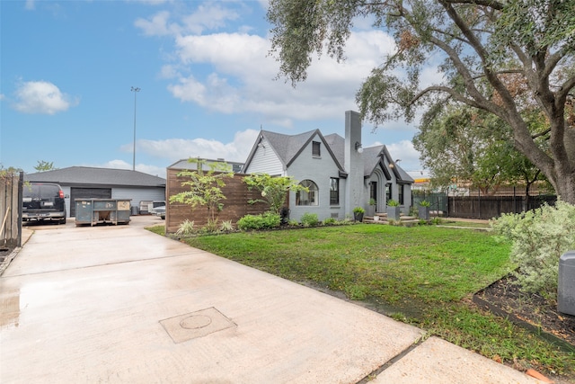 view of front of property with a front lawn and a carport