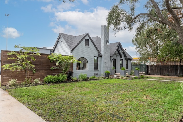 rear view of property with a yard