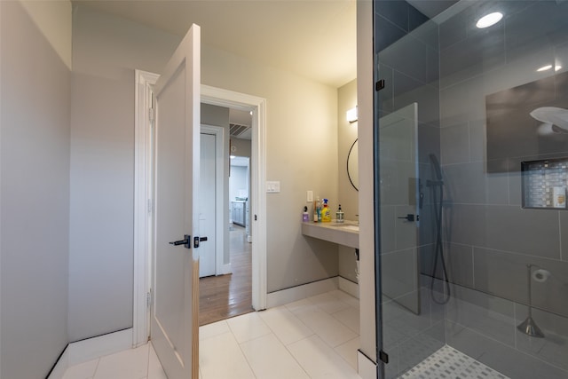 bathroom featuring a shower with door, vanity, and wood-type flooring