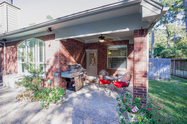 exterior space with grilling area and ceiling fan