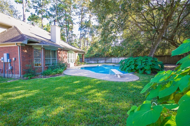 view of yard with a fenced in pool