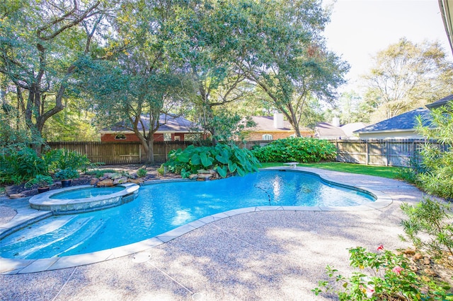 view of pool featuring an in ground hot tub and a patio