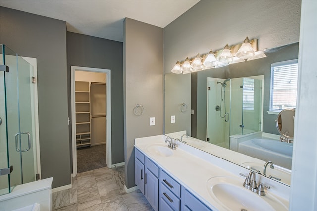 bathroom with vanity and a shower with shower door