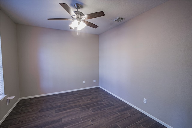 empty room featuring dark hardwood / wood-style floors and ceiling fan