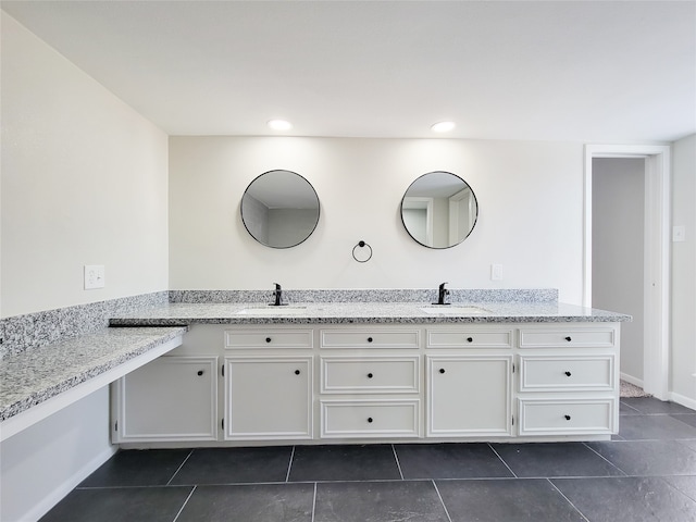 bathroom with vanity and tile patterned flooring