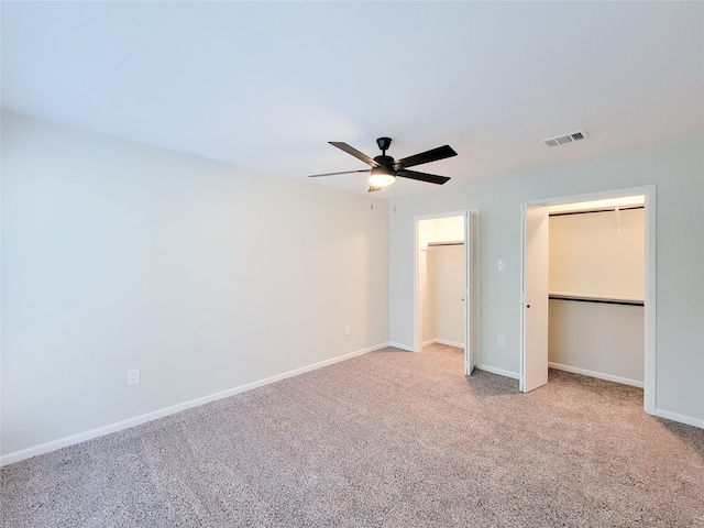 unfurnished bedroom with carpet flooring, a closet, and ceiling fan