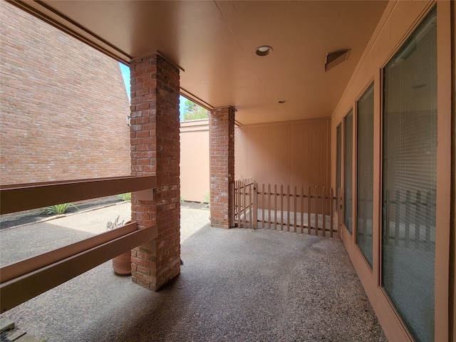 view of patio featuring a balcony