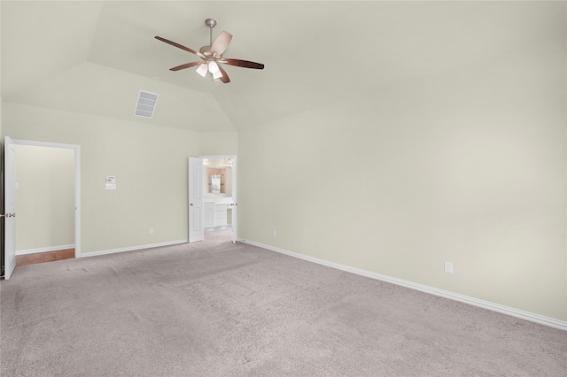 carpeted spare room featuring high vaulted ceiling and ceiling fan