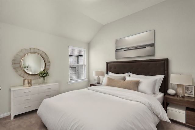 bedroom featuring lofted ceiling and dark carpet