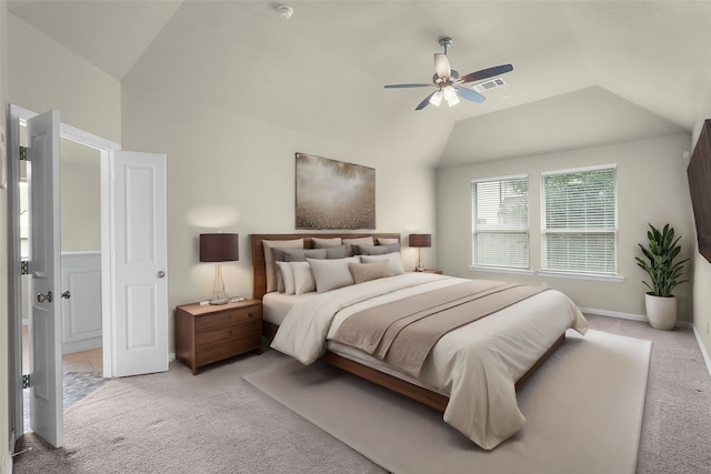 bedroom featuring ceiling fan, lofted ceiling, and light colored carpet