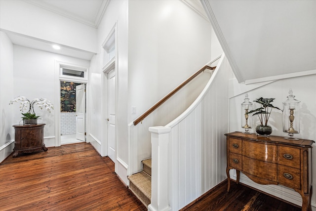 stairway with crown molding and hardwood / wood-style flooring