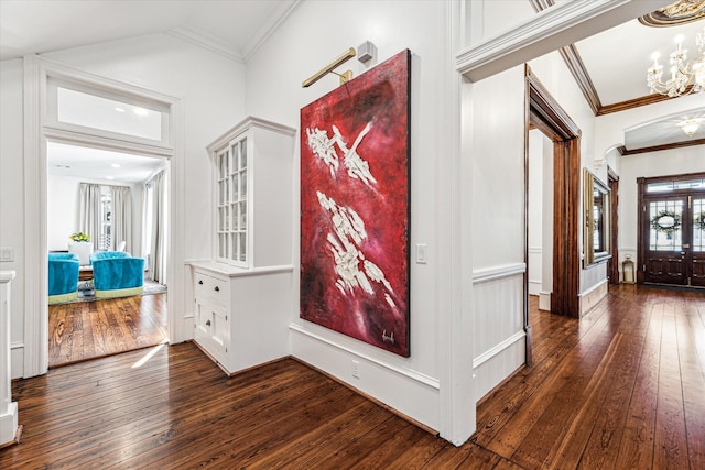 hallway featuring lofted ceiling, crown molding, and dark hardwood / wood-style floors