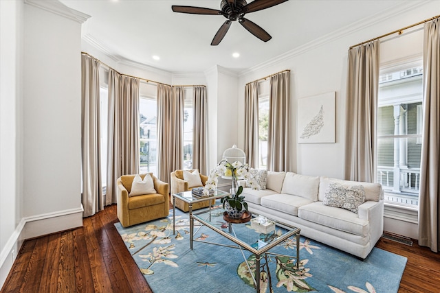 living room with ceiling fan, crown molding, and dark hardwood / wood-style flooring