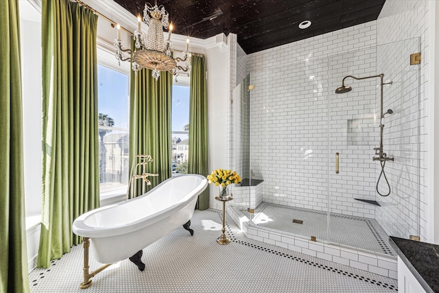 bathroom featuring vanity, tile patterned floors, and plus walk in shower