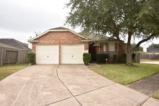 ranch-style house featuring a front yard and a garage