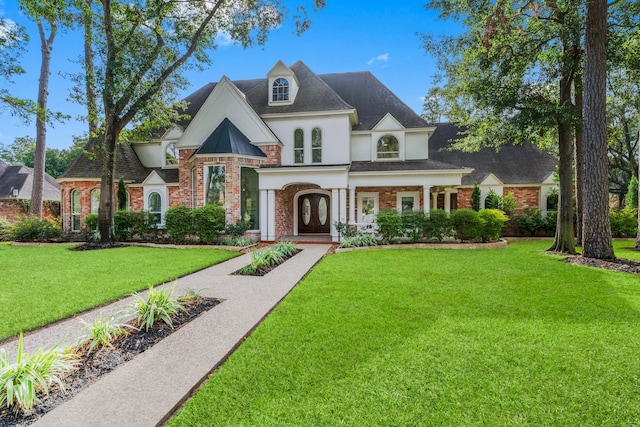 view of front of house with a front lawn and covered porch