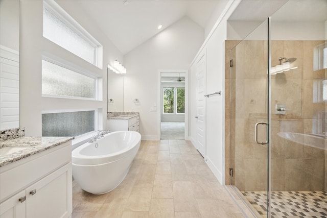 bathroom featuring tile patterned floors, vanity, ceiling fan, high vaulted ceiling, and independent shower and bath