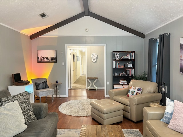 living room featuring ornamental molding, lofted ceiling with beams, a textured ceiling, and dark hardwood / wood-style flooring