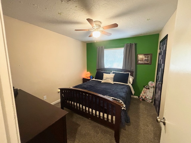 carpeted bedroom with a textured ceiling and ceiling fan