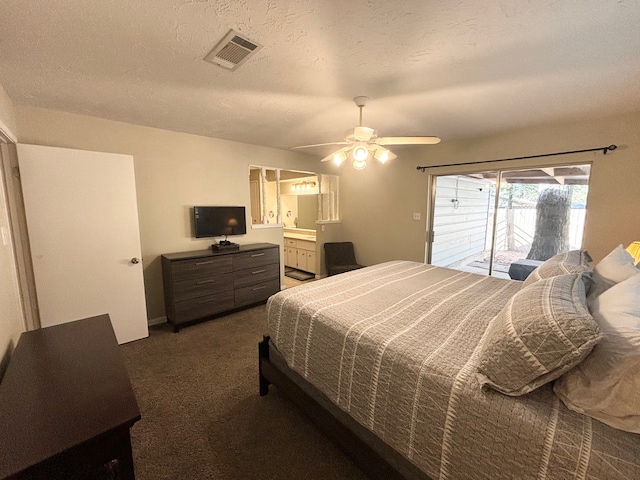 carpeted bedroom with ensuite bath, a textured ceiling, access to outside, and ceiling fan