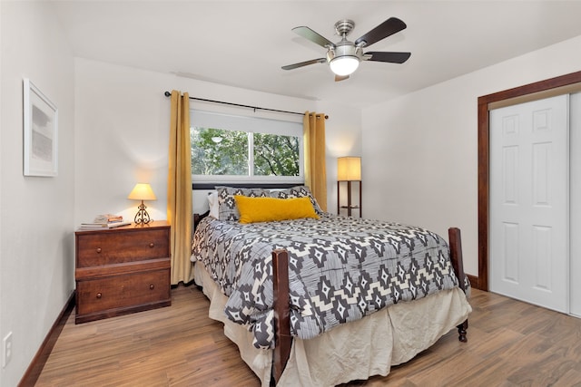 bedroom featuring hardwood / wood-style floors and ceiling fan