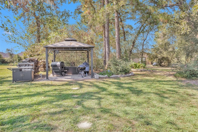 view of yard featuring a gazebo and a patio area