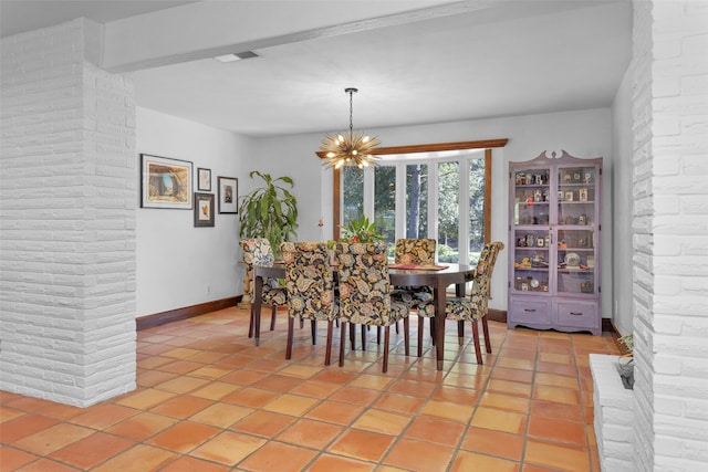 dining space with light tile patterned flooring, beamed ceiling, and an inviting chandelier