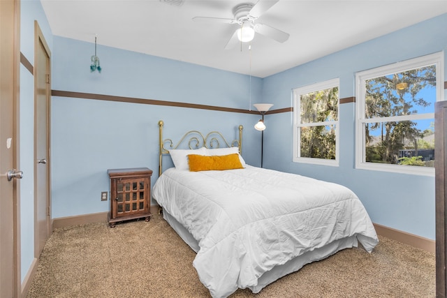 bedroom featuring ceiling fan and carpet floors