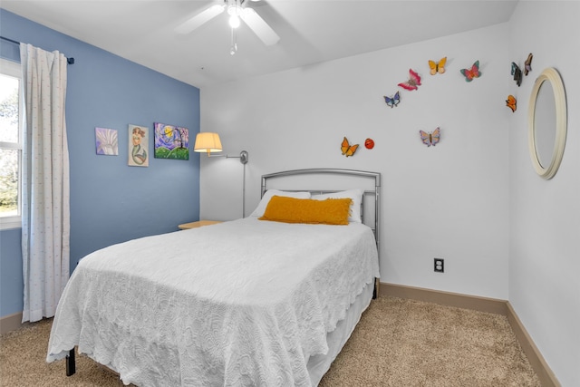 bedroom with light colored carpet and ceiling fan