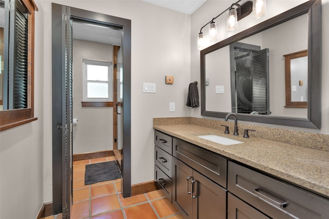 bathroom with vanity and tile patterned flooring