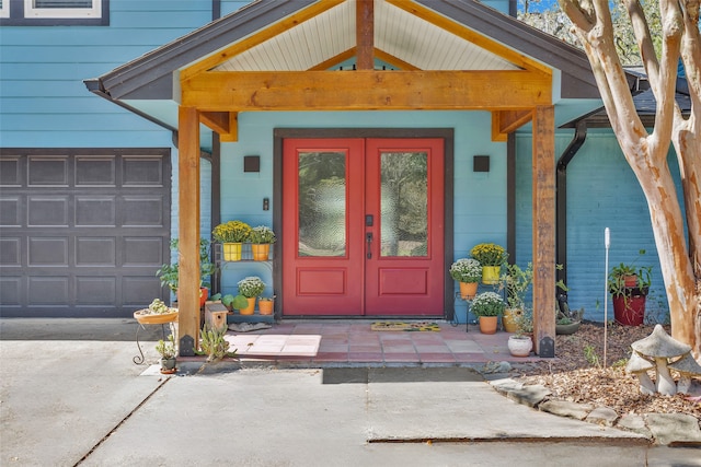 doorway to property featuring a porch and french doors