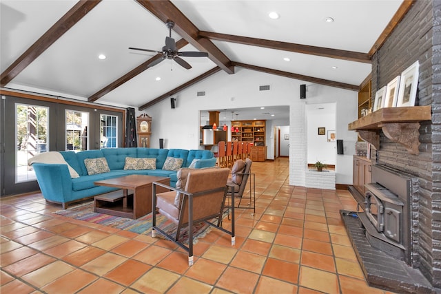 living room featuring ceiling fan, vaulted ceiling with beams, and tile patterned flooring