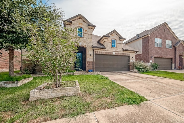 view of front facade featuring a front lawn and a garage