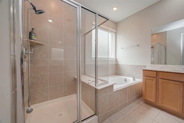 bathroom with vanity, separate shower and tub, and tile patterned flooring