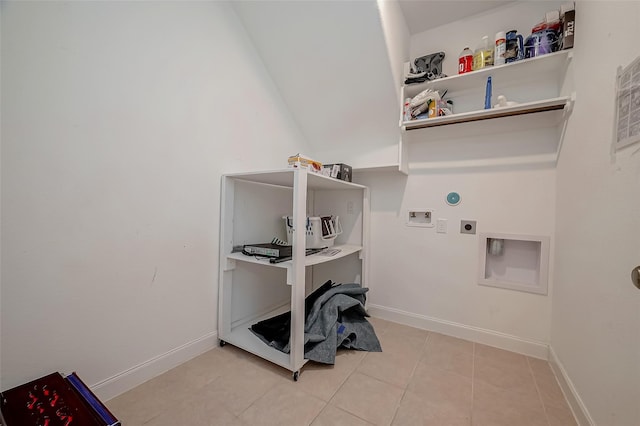 laundry area with electric dryer hookup, washer hookup, and light tile patterned floors