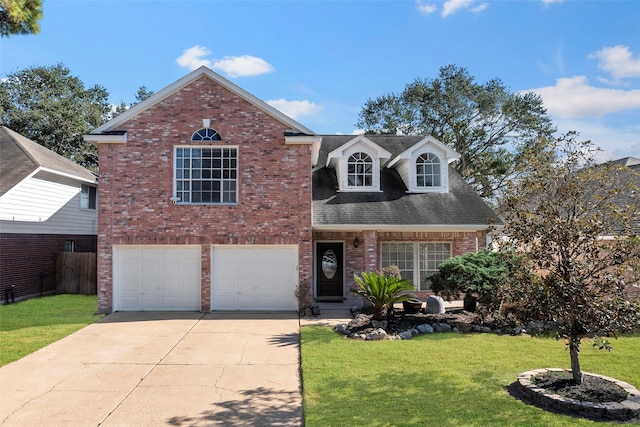 view of front of house with a front yard and a garage