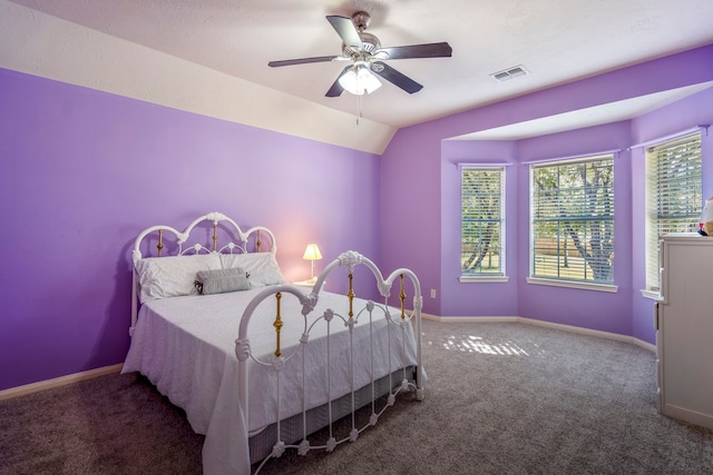 carpeted bedroom featuring ceiling fan and lofted ceiling