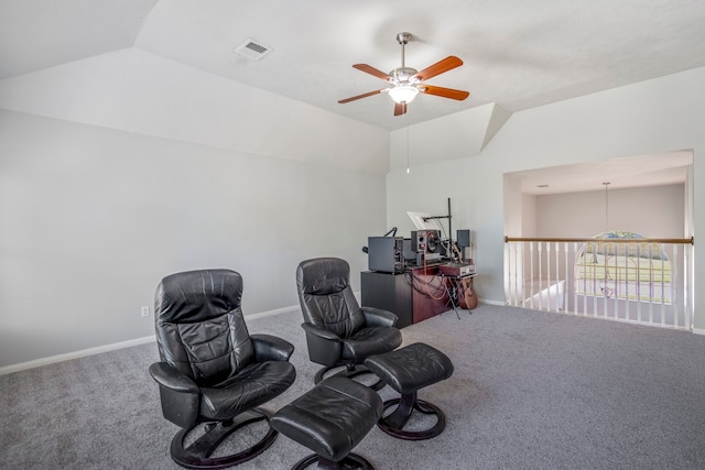 living area featuring carpet, ceiling fan, and lofted ceiling