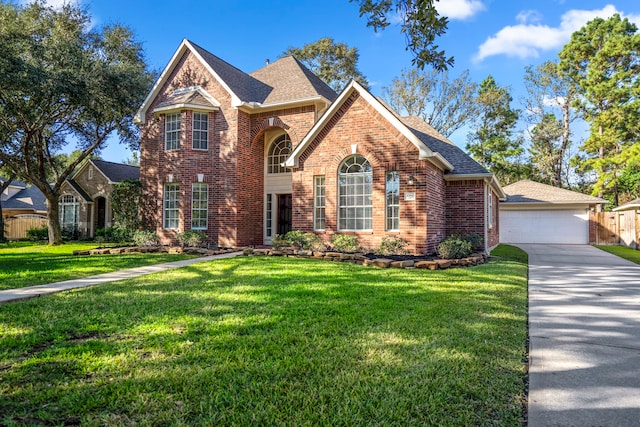 view of front property with a front yard and a garage