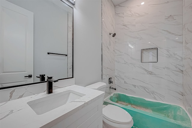 full bathroom with tiled shower / bath combo, vanity, and toilet