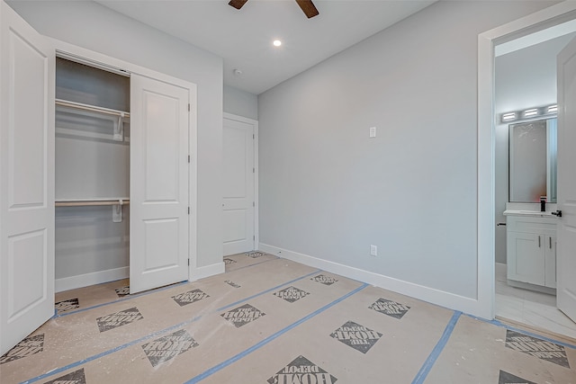 bedroom featuring ceiling fan, connected bathroom, and a closet