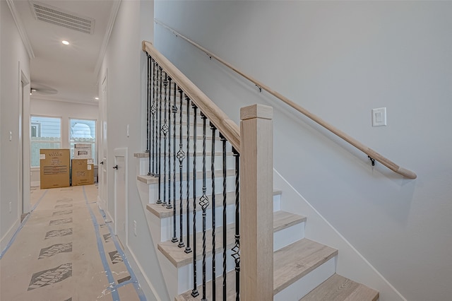 staircase with crown molding