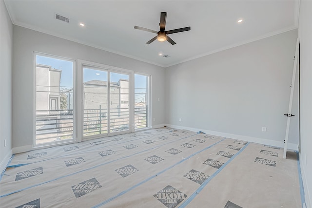 spare room with crown molding and ceiling fan