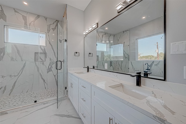 bathroom with vanity and a shower with shower door