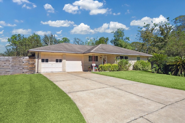 ranch-style home featuring a front yard and a garage